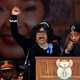 Zindzi Mandela, left, and sister Zenani, center, pay tribute to their mother Winnie Mandela in April 2018